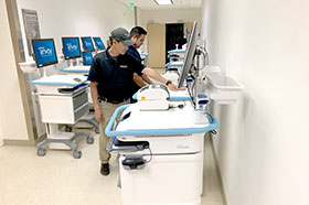 Technicians installing workstations